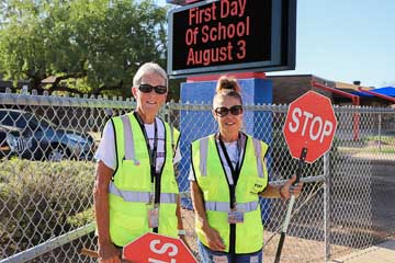 Crossing guards help keep kids safe on the first day of school, Aug 3, 2023.