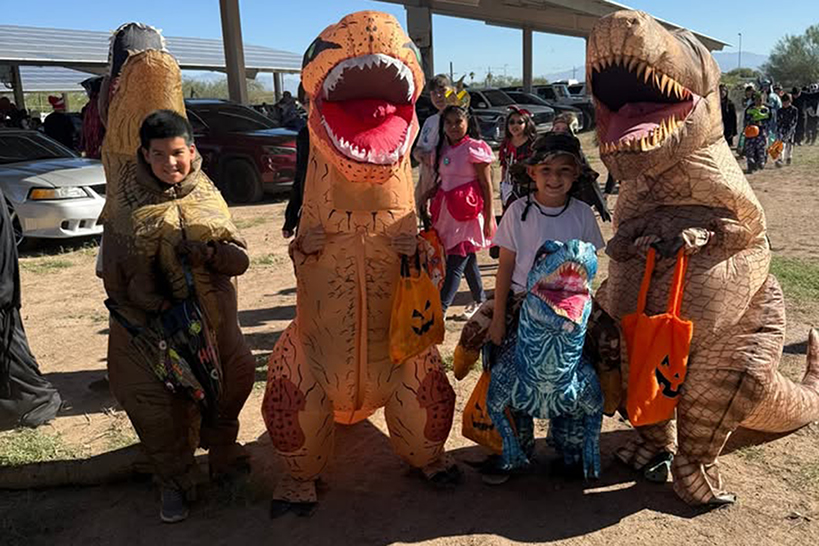 A group of students in inflatable dinosaur costumes